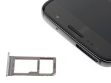 The Galaxy S7 has a place for a microSD card, the iPhone 6s does not - Galaxy S7 vs. iPhone 6s